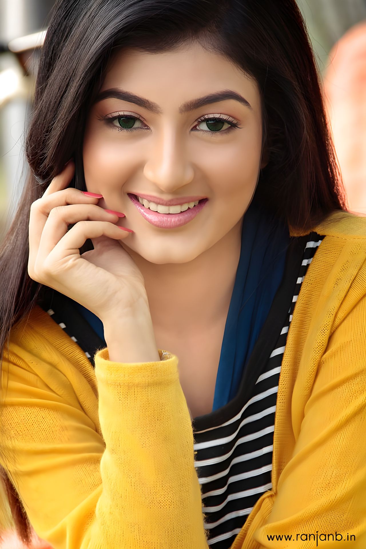 A close-up portrait of Ratasree Dutta smiling, captured by Ranjan Bhattacharya in Kolkata.