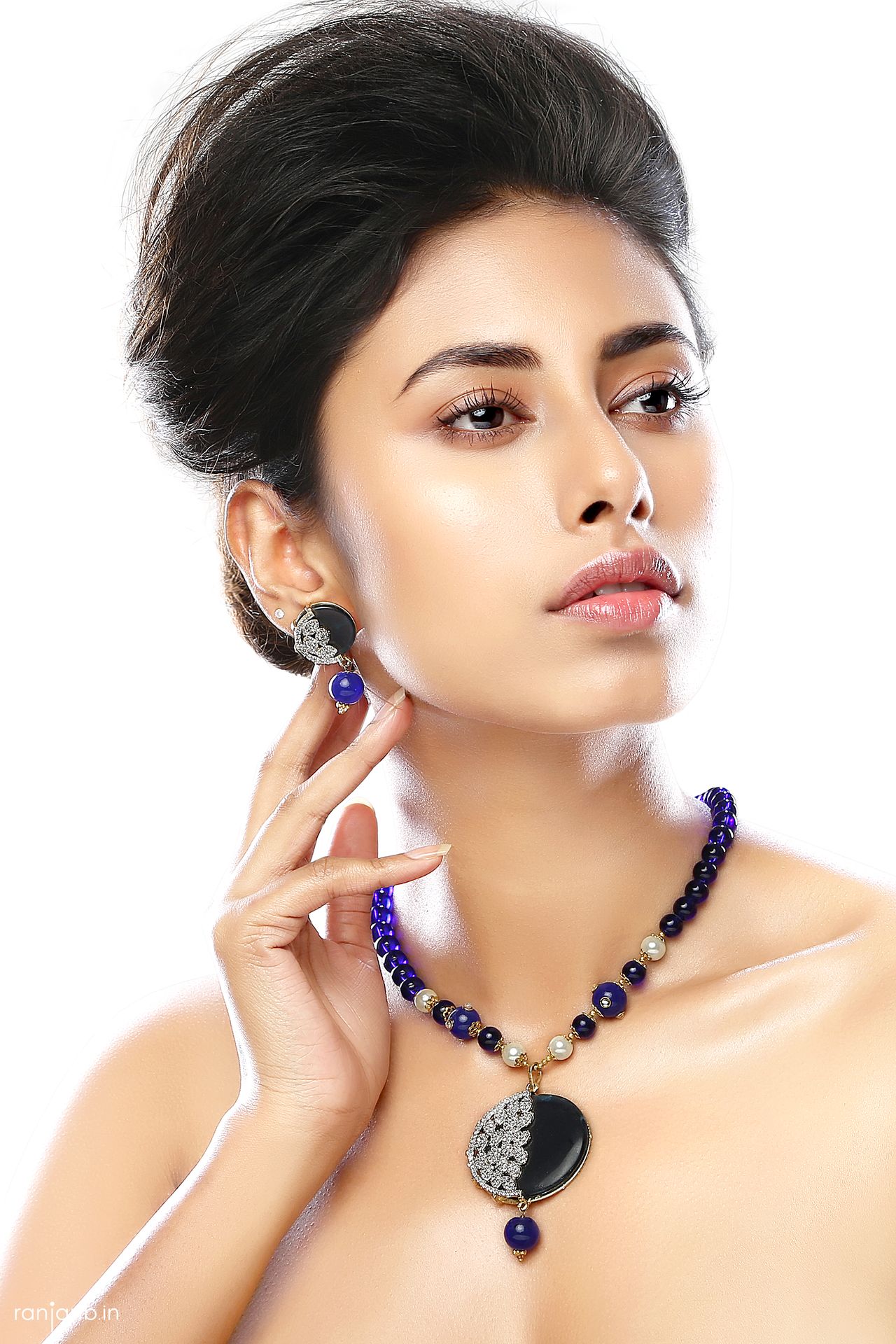 A stunning portrait of Ankita Saha, showcasing her necklace and earrings, taken by Ranjan Bhattacharya.