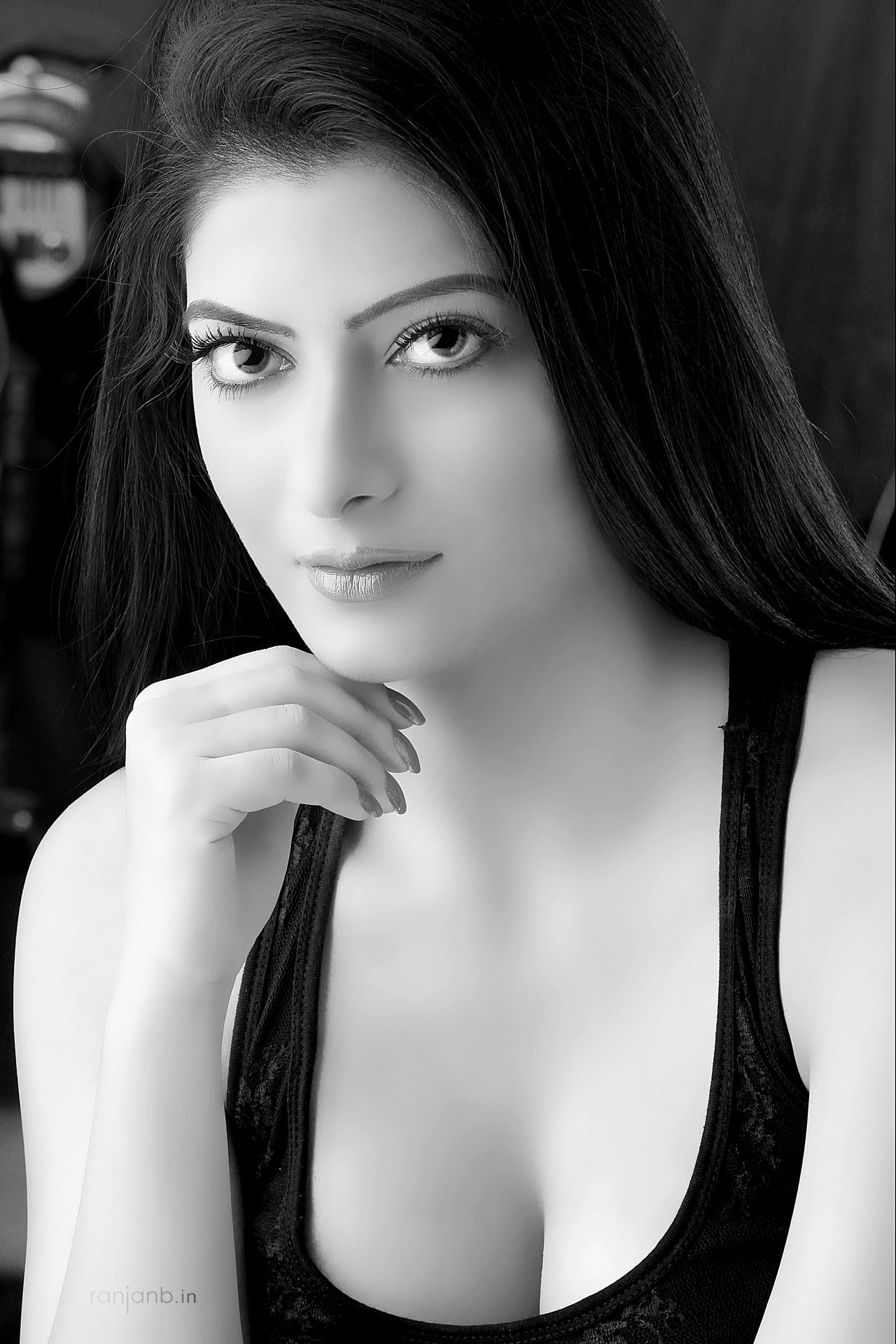 A striking black & white portrait of a model from Mumbai, emphasizing her expressive eyes and delicate features. Photographed by Ranjan Bhattacharya.