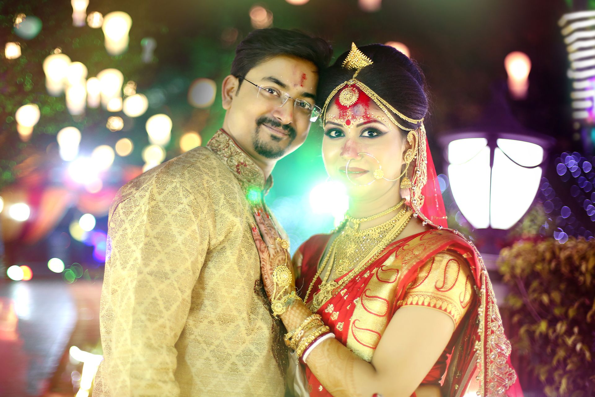 Candid shot of the bride and groom sharing a laugh during their wedding reception.