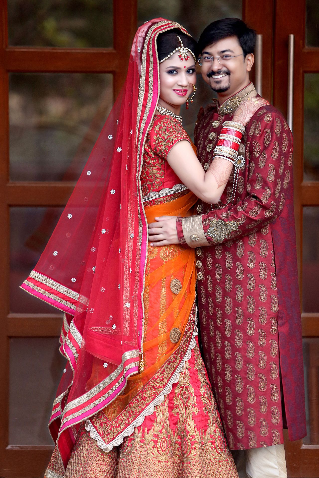 A joyful wedding moment where a guy hold his fiancée, captured by the best wedding photographer Ranjan Bhattacharya.