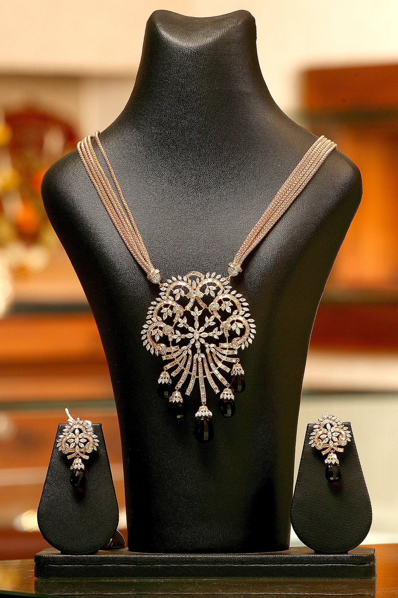 Mannequin showcasing necklaces and earrings, professional jewelry photography