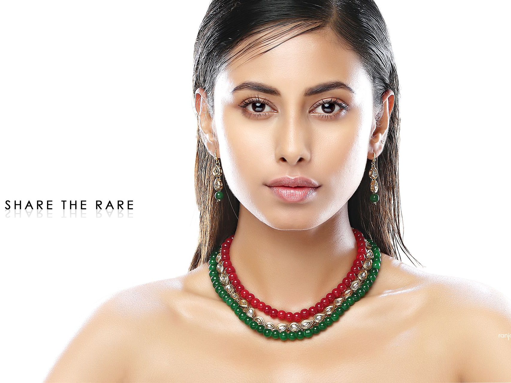 Ankita Saha posing with traditional jewelry during a professional photoshoot by Ranjan Bhattacharya.