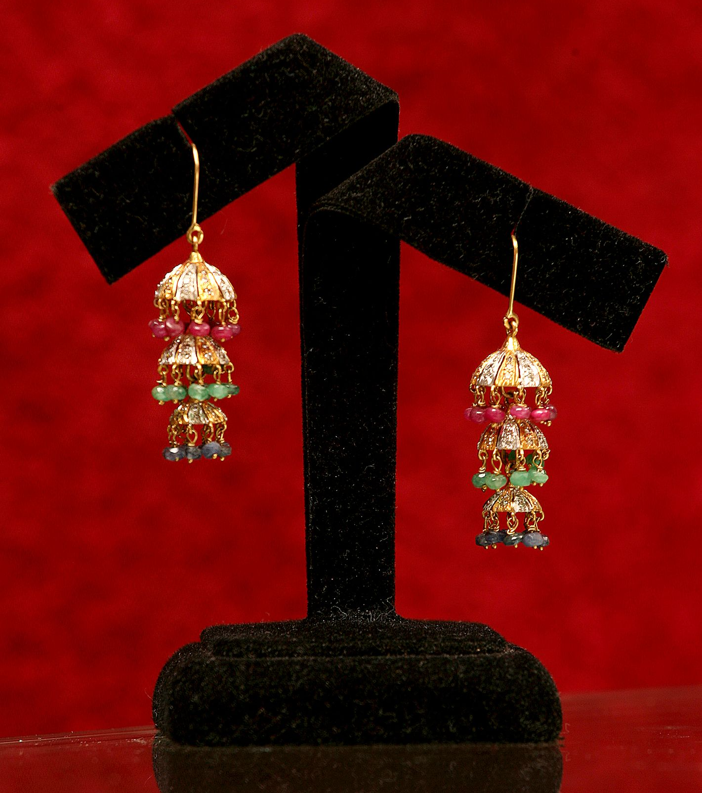 Detailed shot of earrings on a display stand, creative backdrop