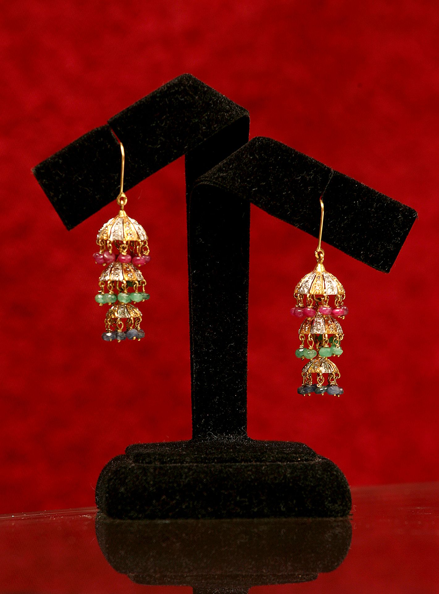 Detailed shot of earrings on a display stand, creative backdrop