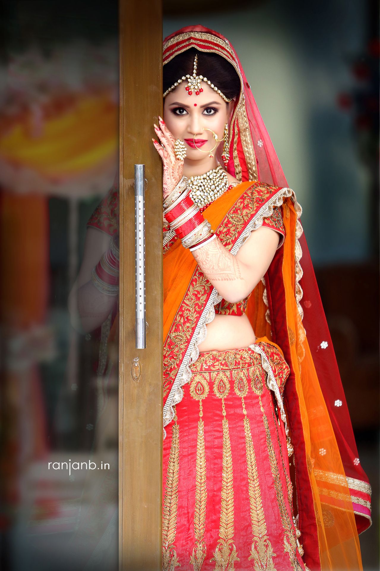 A mid-bust portrait of a woman in a traditional saree, highlighting her natural beauty, photographed by Ranjan Bhattacharya.