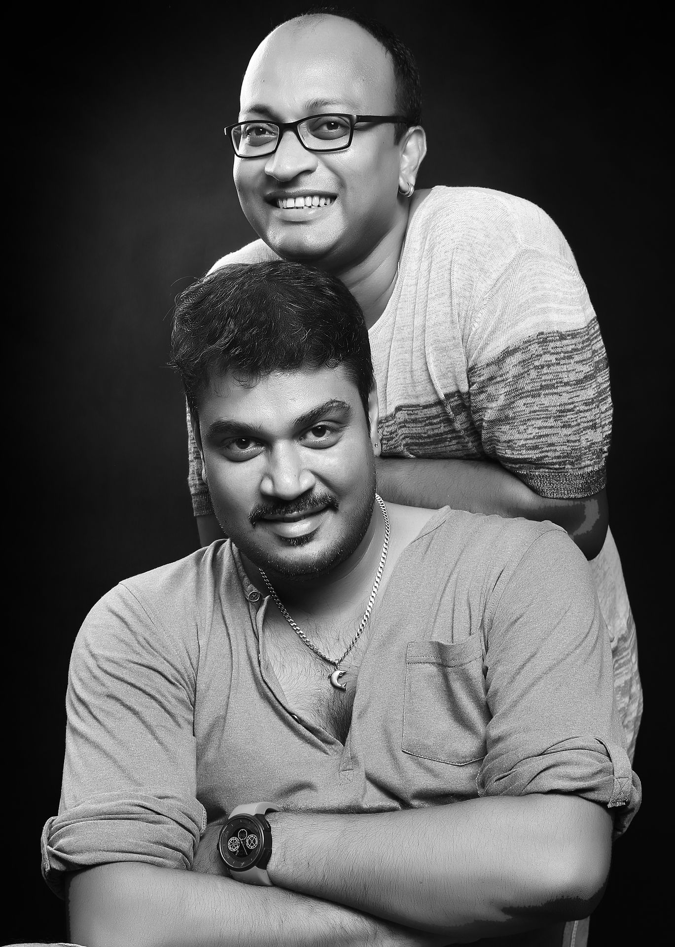 Ranjan Bhattacharya and Nanda Majumdar captured in a portrait, reflecting their personalities and formal attire.