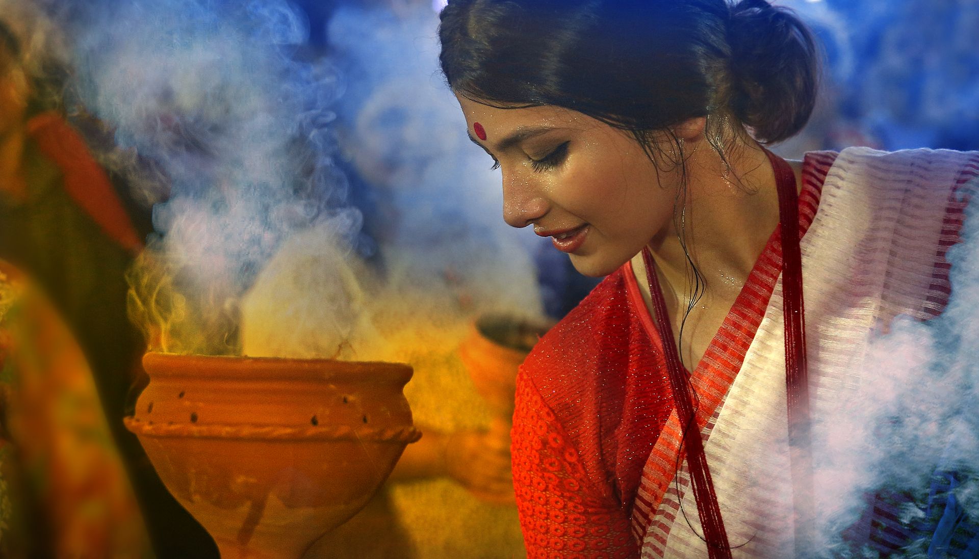 A close-up portrait of a woman in a traditional saree, highlighting her natural beauty, photographed by Ranjan Bhattacharya.