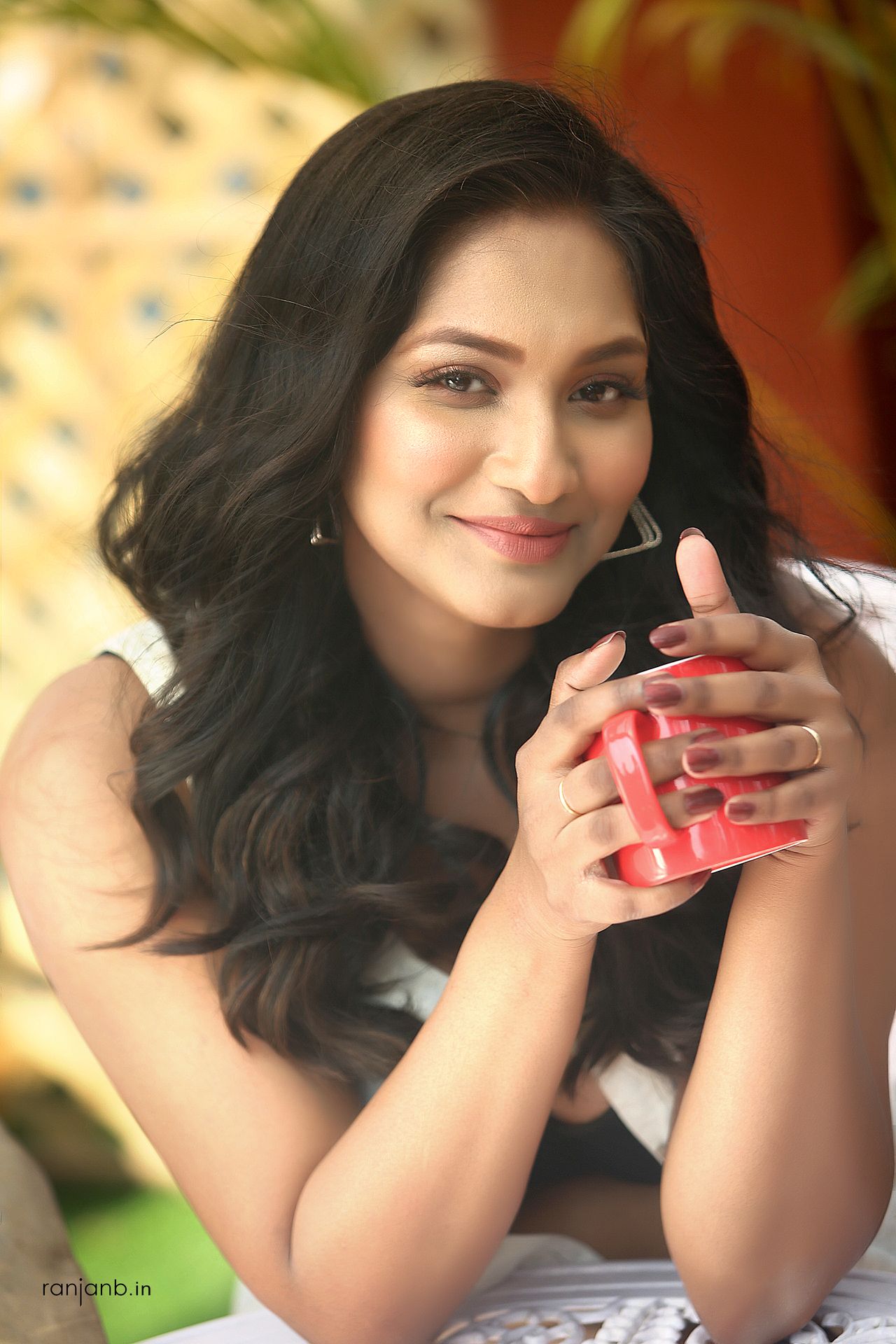 A close-up portrait of a woman in a casual outfit, highlighting her natural beauty, photographed by Ranjan Bhattacharya.