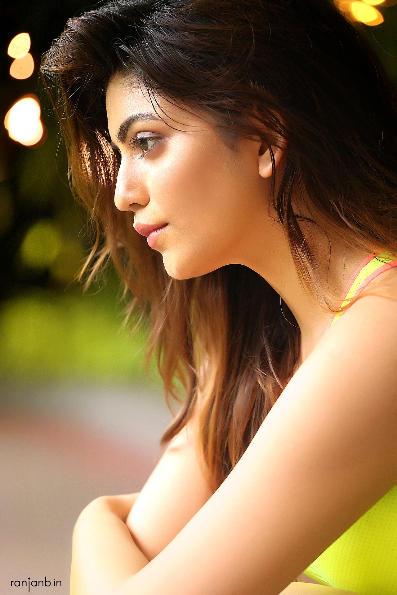 A close-up portrait of a woman in a sports bra, highlighting her natural beauty, photographed by Ranjan Bhattacharya.