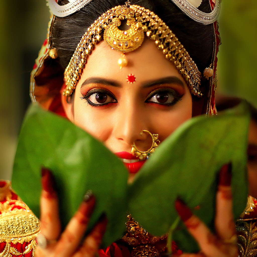 A beautiful wedding moment captured by Ranjan Bhattacharya, featuring the bride in a romantic setting.