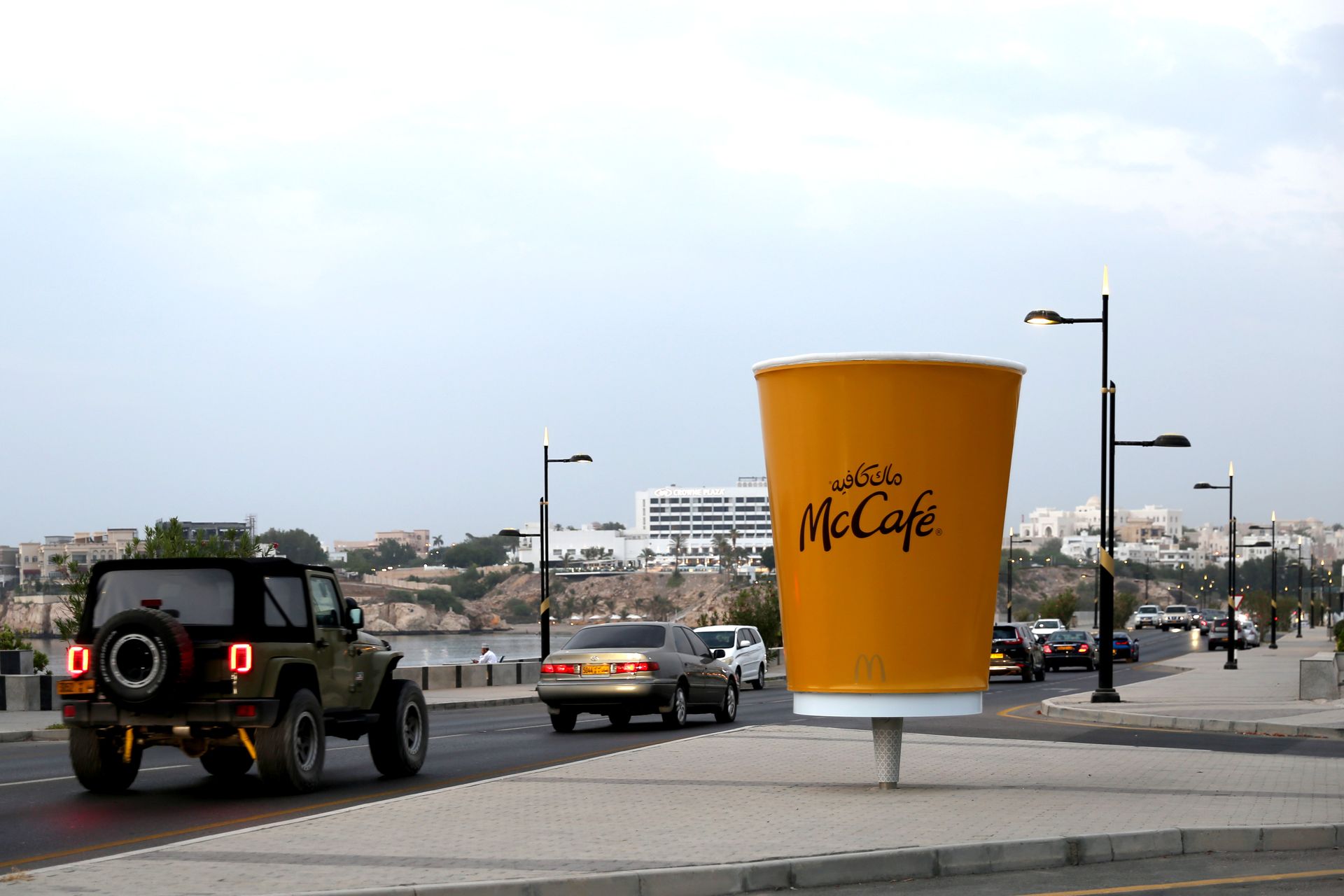 A coffee brand placed oversized coffee cups in busy pedestrian zones, filled with realistic steam effects to catch people's attention.